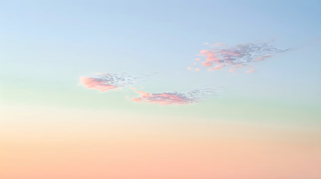 Soft pink and blue sunset sky with fluffy clouds at twilight