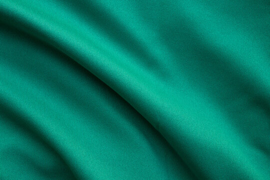 Green sports clothing fabric football shirt jersey texture close up
