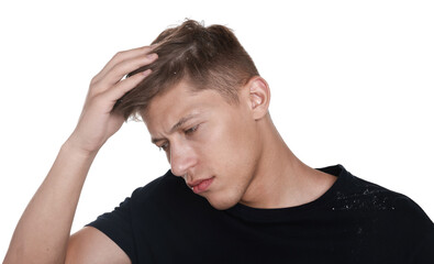 Fototapeta premium Unhappy man suffering from dandruff on white background