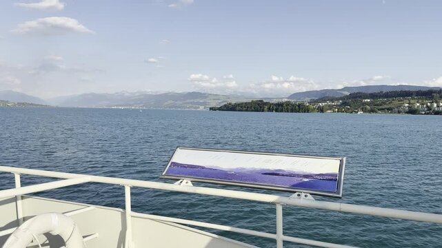 Ferry Deck with Life Buoy and Alpine Panorama Sign on Lake Zurich, Switzerland