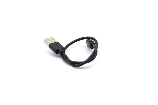 A black USB cable on a white background. A USB cable for data transfer.