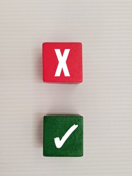Voting yes or no. Positive or negative decision. To accept or reject. The opposite label right or cancel on colorful cubes on white background