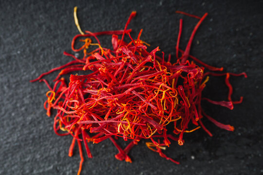 fragrant expensive spice saffron on a dark stone background