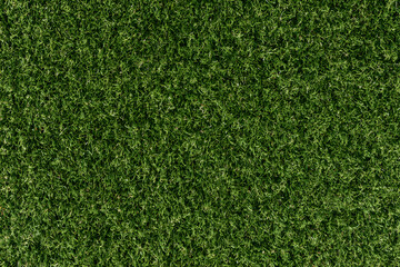 Fototapeta premium A top-down aerial photo texture of lush green sports field grass, suitable for a golf course, soccer field, football pitch, or rugby turf.