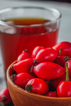 fresh red rosehip tea on a stone background
