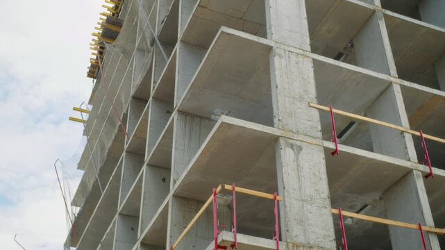 Low angle view of unfinished concrete apartment building