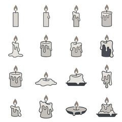 Fototapeta premium Melting wax candles in different heights and shapes.