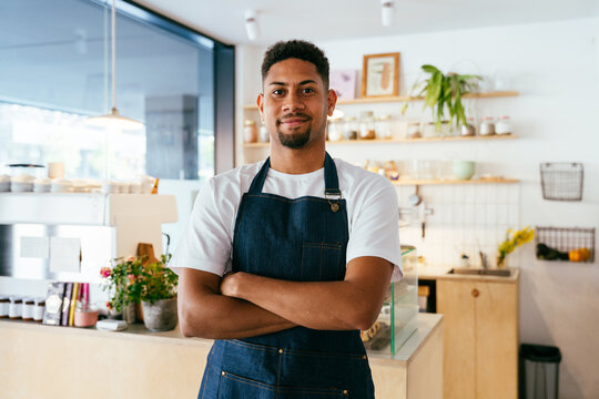 Barista working in a bar cafeteria