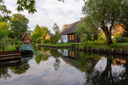 Lehde, Germany - July 16, 2026 Traditional Spreewald village houses along a peaceful canal in the Spreewald during sunset