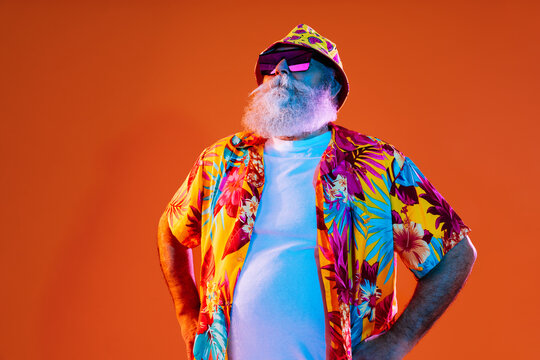 Senior old man with gray beard portrait in studio