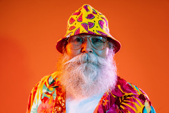 Senior old man with gray beard portrait in studio