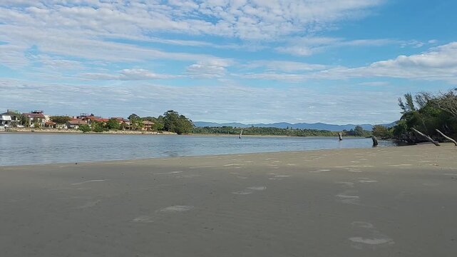 Winter view of barra de ibiraquera with sandy shore and lagoon