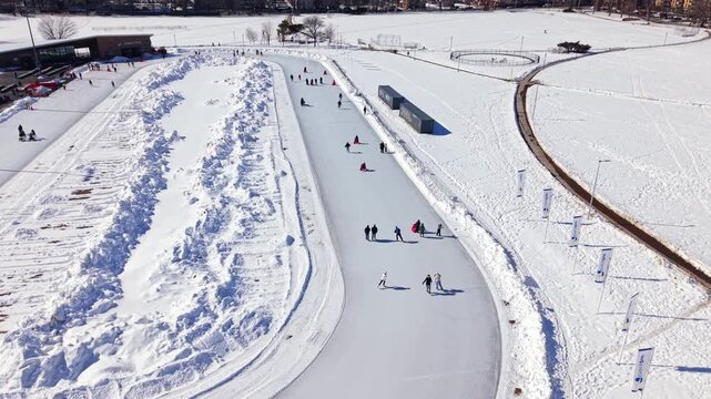 Gliding joy at the Halifax ice rink in winter's embrace, where laughter and skates dance under the New Scotland sky