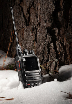 Handheld transceiver in a forest after a snowstorm