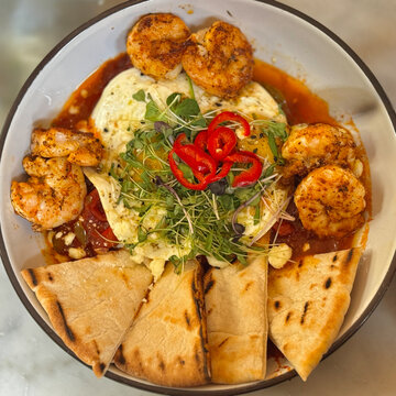 Delicious grilled shrimp shakshuka tasted for dinner in Savannah, Georgia