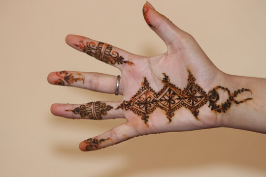 Moroccan Traditional Henna Designs on Hands, Hand Henna Close-Up with Intricate Traditional Designs