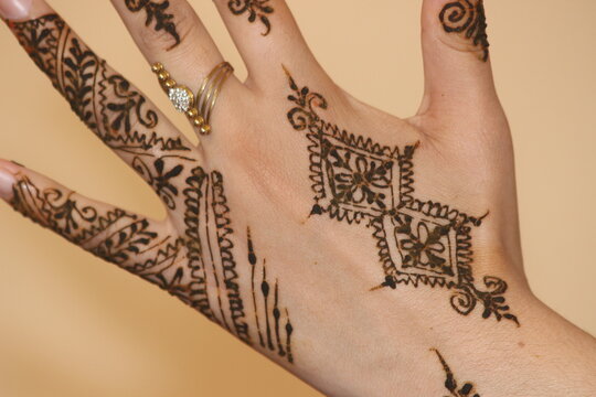 Moroccan Traditional Henna Designs on Hands, Hand Henna Close-Up with Intricate Traditional Designs