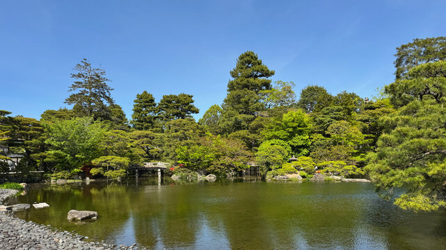 Garden with stone bridge at Kyoto Imperial Palace in Japan