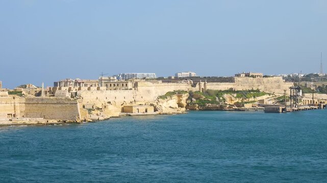 fort ricasoli and fort st elmo bastions frame the grand harbour entrance wide view of the fortified passage star fort knights of malta fortress valletta fortification harbour entrance fort
