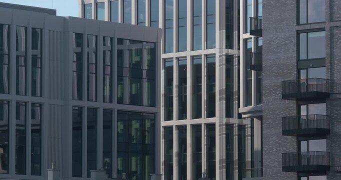 Modern city architecture office apartment buildings vertical line symmetry long windows