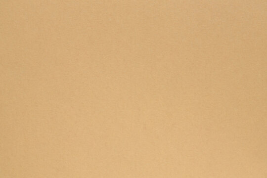 Beige paper background with smooth surface texture for minimalist design and copy space