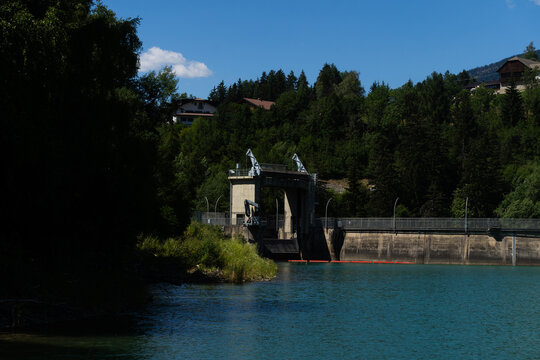 Peaceful Lake With Mountain, Tranquil Alpine Landscape With Shimmering Waters And Slopes