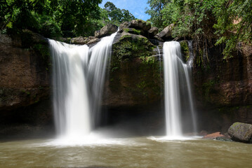 Naklejka premium Twin Waterfalls in a Lush Tropical Forest, Thailand