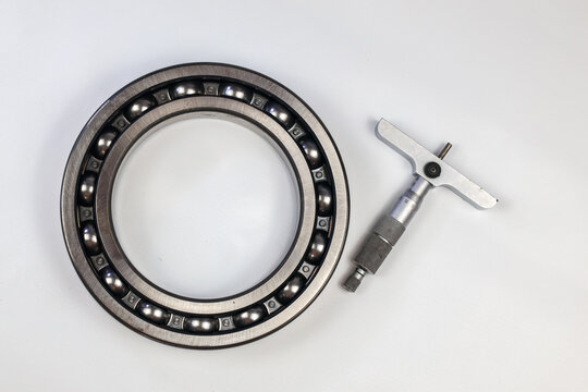Steel ball bearing and micrometer depth gauge.
