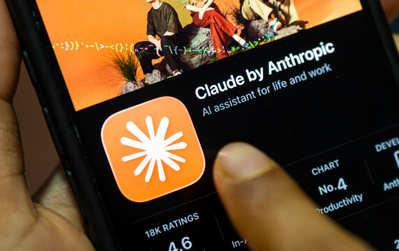 In this photo illustration, a person holds a smartphone displaying the Claude by Anthropic app on the App Store, in New Delhi, India on 8 August 2026.