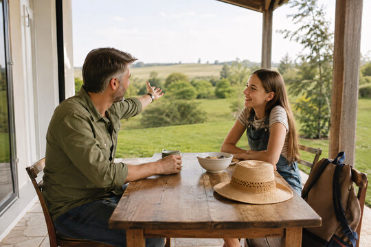 Father and Teenage Daughter Reconnecting at a Countryside Retreat