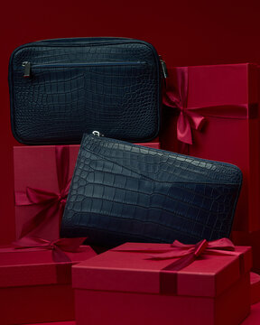 Gift boxes with dark bags and red background