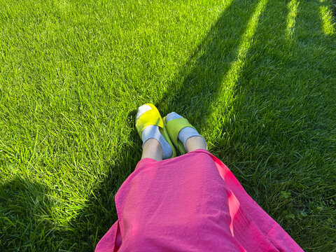 A woman sitting on the grass