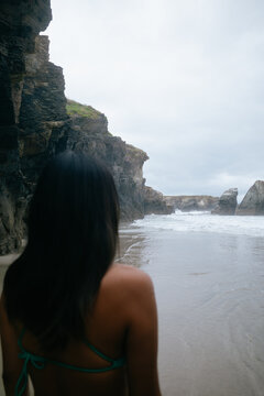 Woman Admiring Coastal Cliff Views