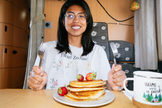 Woman Enjoying Homemade Pancake Breakfast