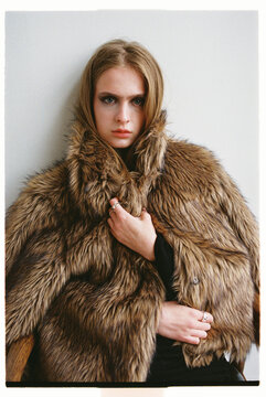 Fashion Model poses with a fur coat