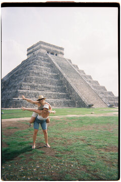 Friends having fun at Chichen Itza ancient Maya ruins