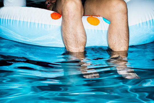 Enjoying a Float in the Pool During a Sunny Day