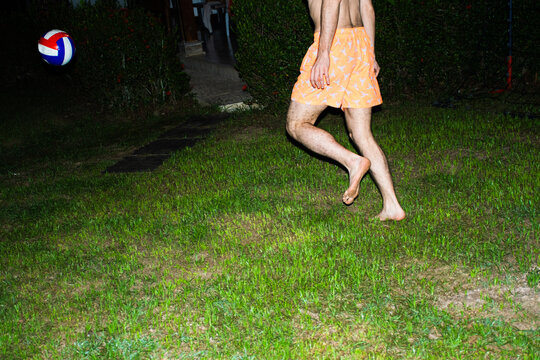 Playing Volleyball in the Yard at Night Under the Lights
