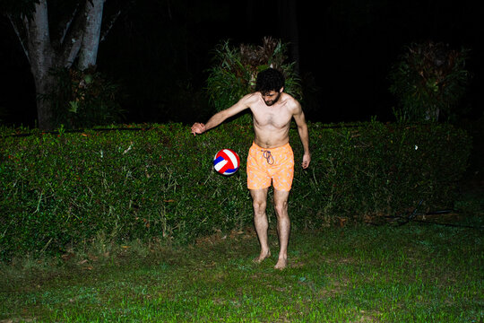 Playing Volleyball in the Dark at a Garden