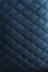 Obraz premium Dark Blue Quilted Velvet Upholstery Texture with Diamond Pattern and Soft Directional Light