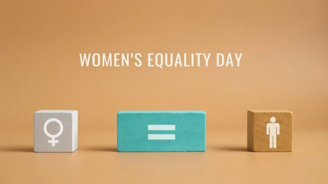 Women's Equality Day banner with gender symbols and equals sign on wooden blocks.