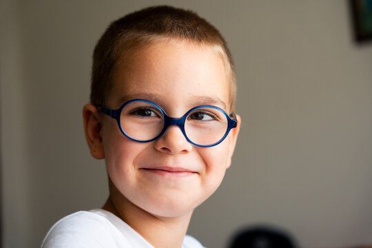 Portrait of Smiling Boy Wearing Glasses