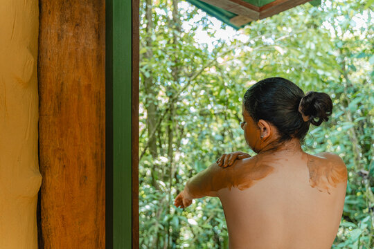 Adult enjoying natural mud spa treatment outdoors