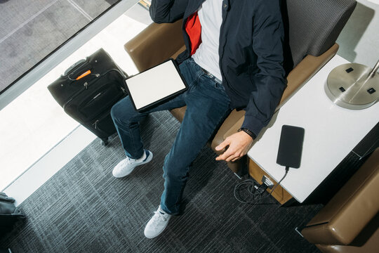 Using tablet in airport lounge