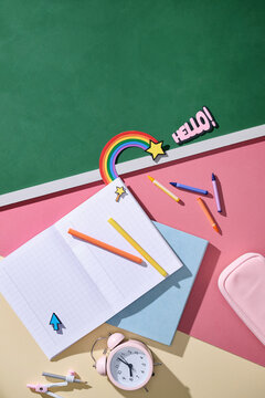 Back to school supplies laid out on a colorful surface