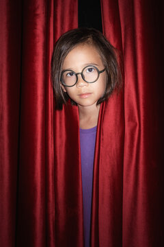 Boy Behind Curtain