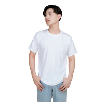 Young man wearing a plain white t-shirt and denim jeans, looking away