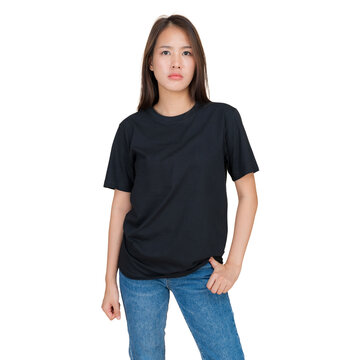 Young woman wearing a plain black t-shirt and blue jeans, standing against a white background