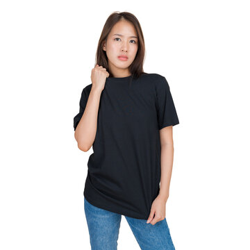 Young woman wearing a plain black t-shirt and blue jeans, isolated on white background
