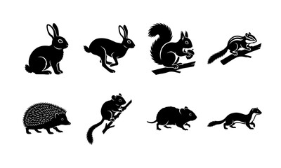 Fototapeta premium Collection of black silhouettes featuring various woodland animals and forest creatures